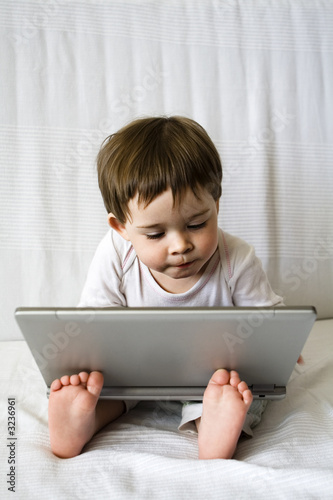 cute baby girl with laptop
