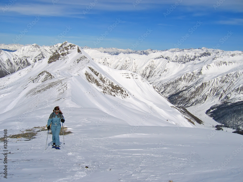 woman mountain trekker with snow shoes,  les orres, alps, france