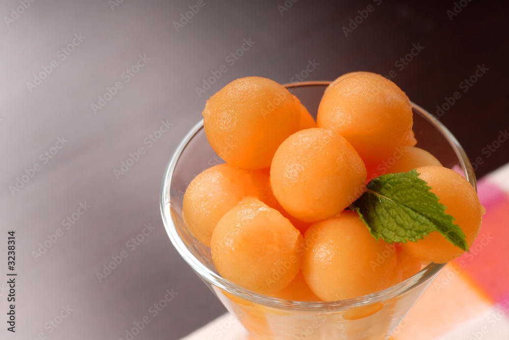 fresh cantaloupe balls in a glass with mint fresh cantaloupe balls in a glass with mint