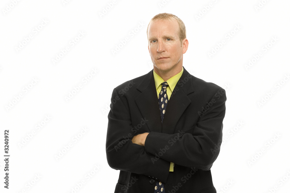 businessman stands with arms crossed businessman stands with arms crossed