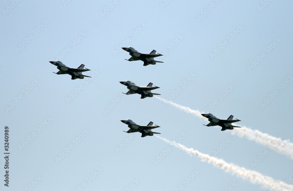 a fighter formation at an air show a fighter formation at an air show