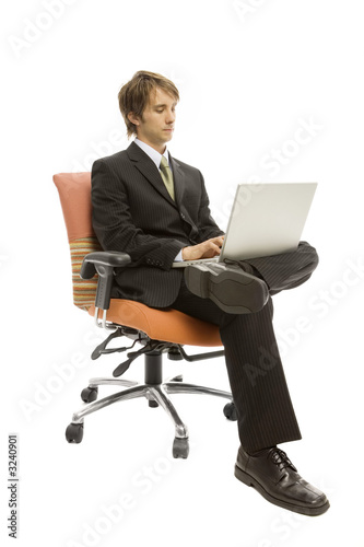 businessman in seat with laptop