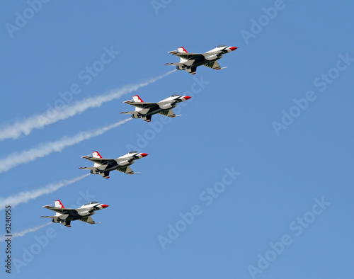 a fighter formation at an air show