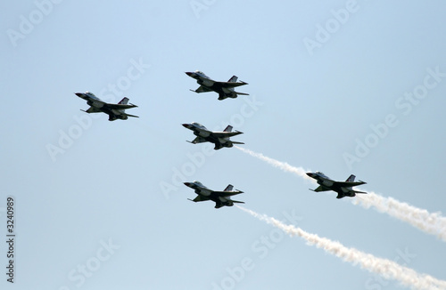 a fighter formation at an air show