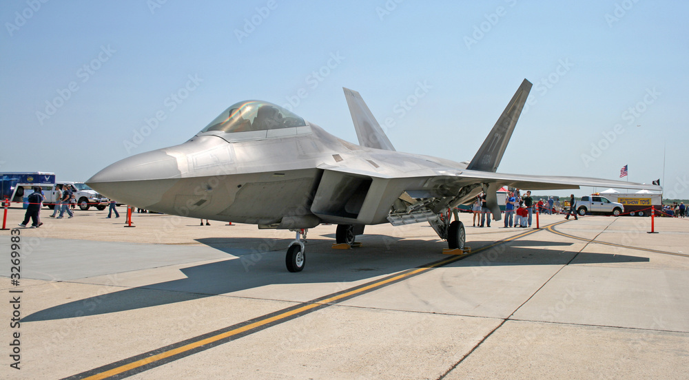 the fighter f-22 displayed at an air show the fighter f-22 displayed at an air show