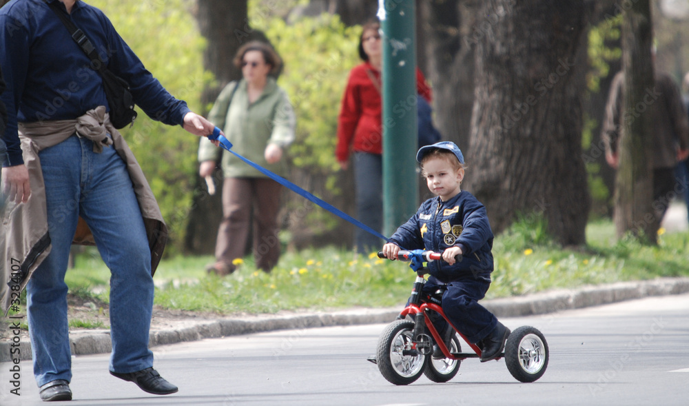 baby on bike in park