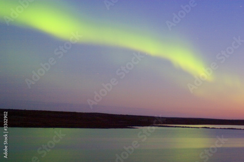 spooky skies in the north of Canada as the northern lights come at sunset