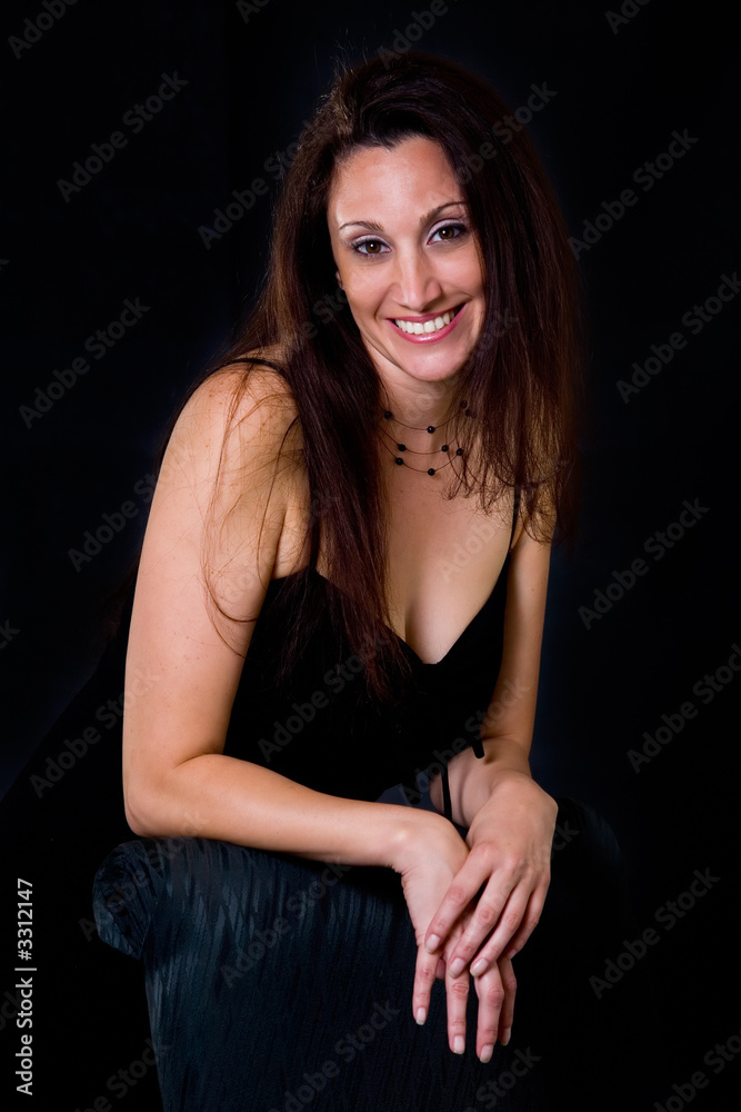 hispanic woman in her 30s in black dress hispanic woman in her 30s in black dress