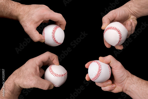 baseballs in hands