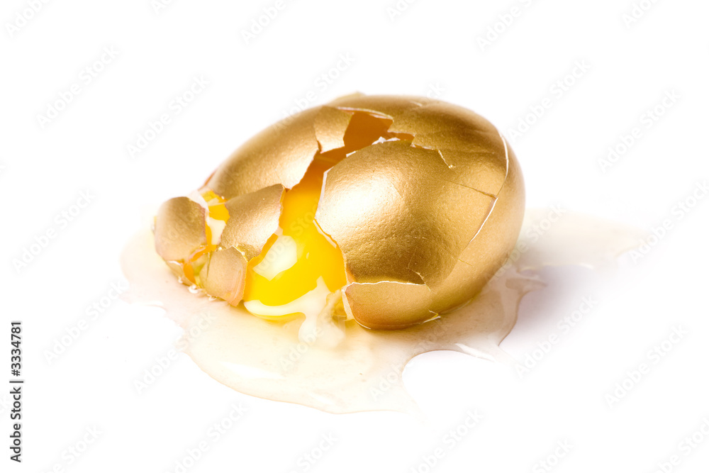 isolated broken golden egg