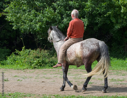 elderly man on horseback