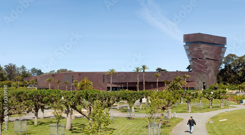 de young museum and man walking