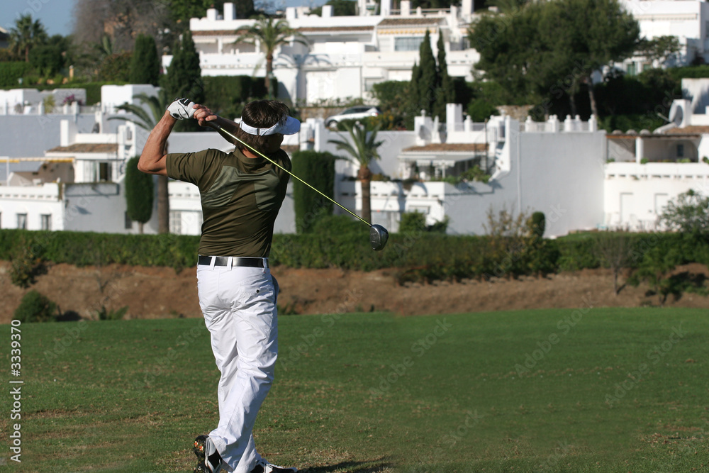 Obraz premium man golf swing in marbella, spain, aloha golf
