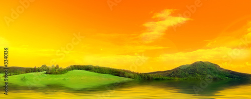 panorama photo of meadow with water in the morning