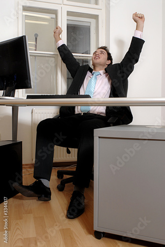 Winning businessman at desk