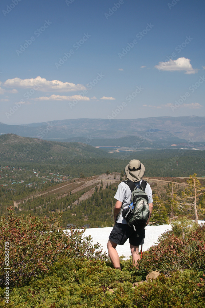 hiker above mountains
