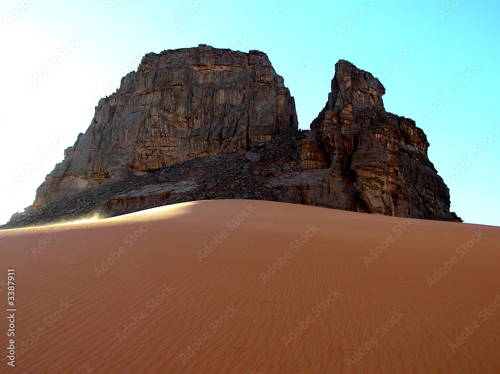 dune and rocks in Sahara desert