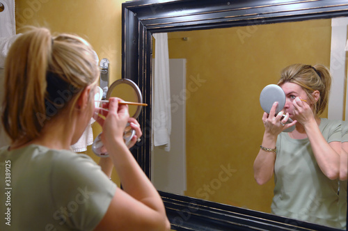 woman applying mascara