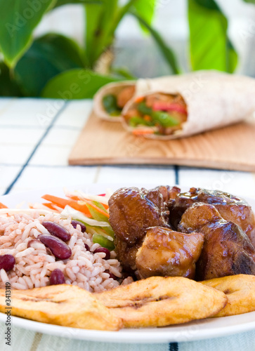 stewed chicken with rice and vegetables - jamaican photo