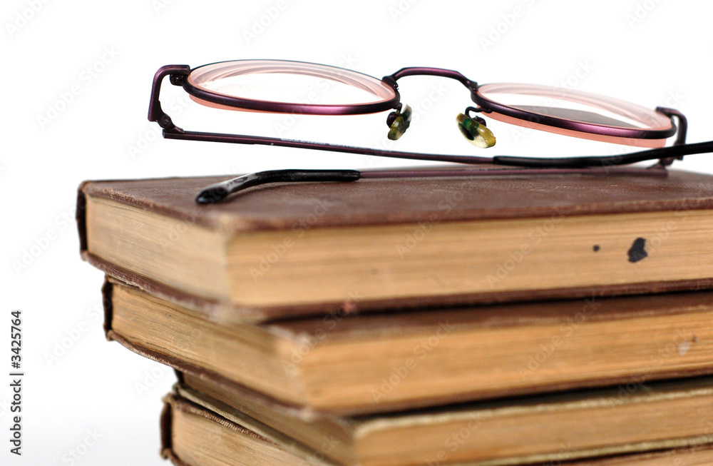 old books and glasses