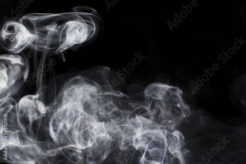 puff of aroma smoke on a dark background