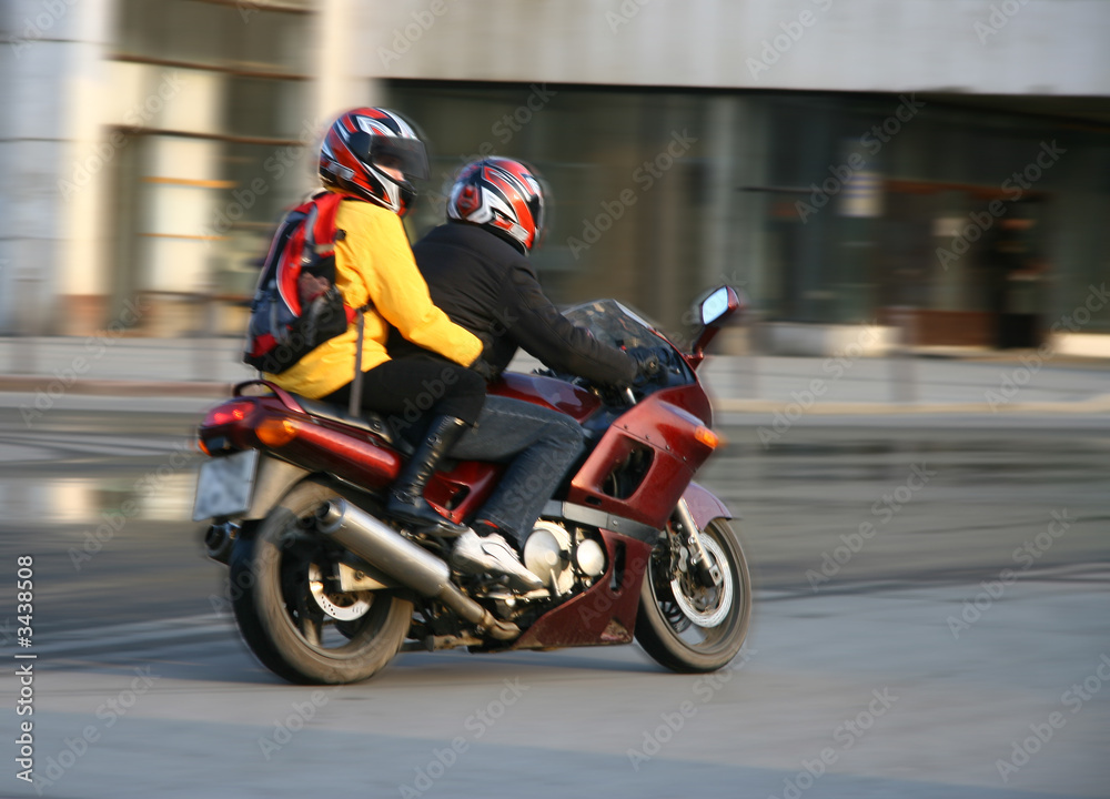 pair on a motorcycle.