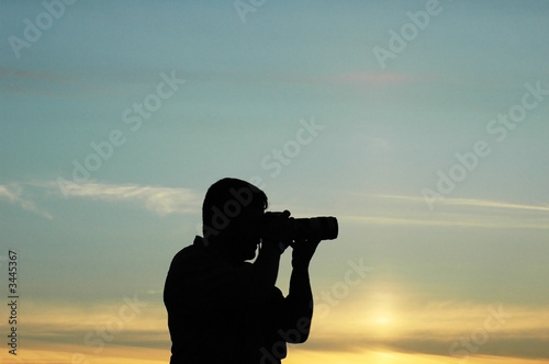 silhouette of a photographer during the sunset