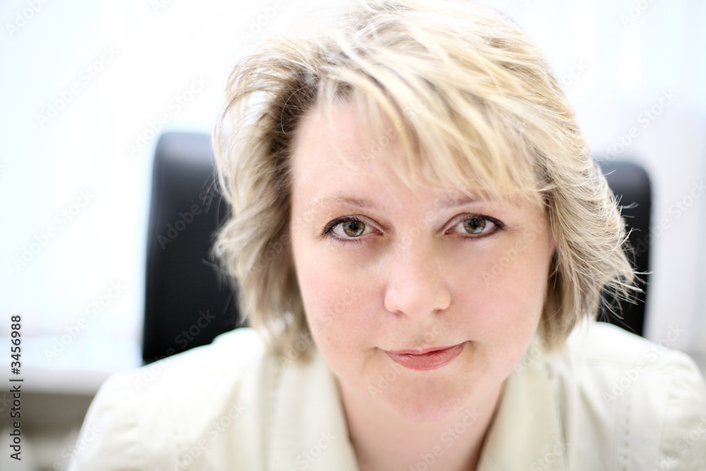 mid-life business woman look at camera mid-life business woman look at camera