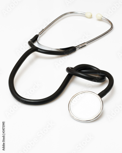 stethoscope isolated on white having a knot