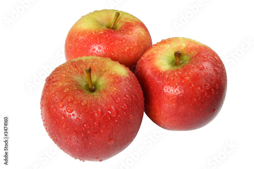 three freshly washed apples covered with droplets