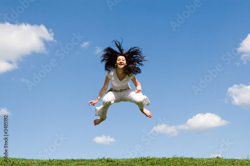 jumping girl in meadow