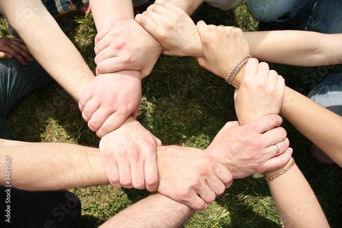 Eight friends have crossed hands photo