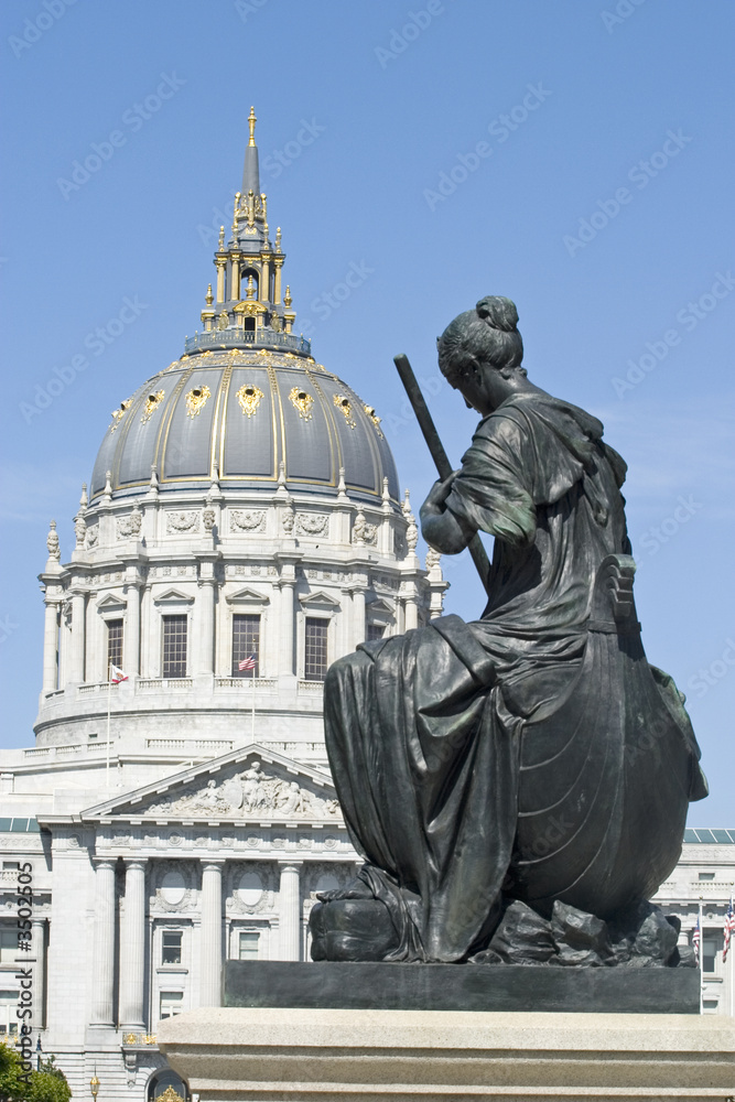  statue with city hall dome portrait
