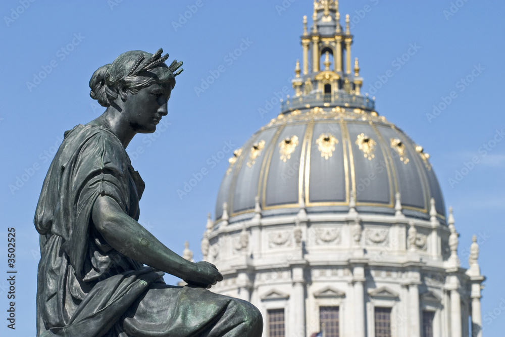  statue with city hall dome and face