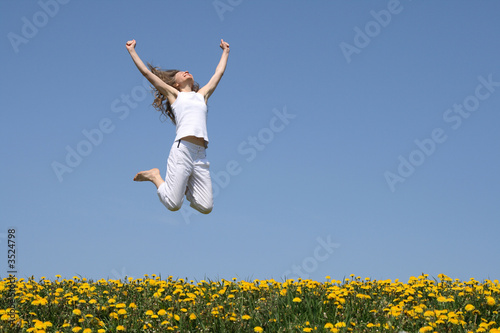 smiling young woman in a happy jump