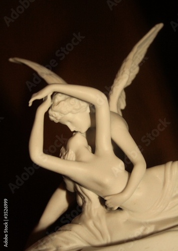 eros and psyche statues angel kissing a woman photo
