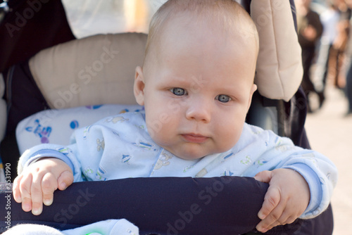 baby walking in carriage photo