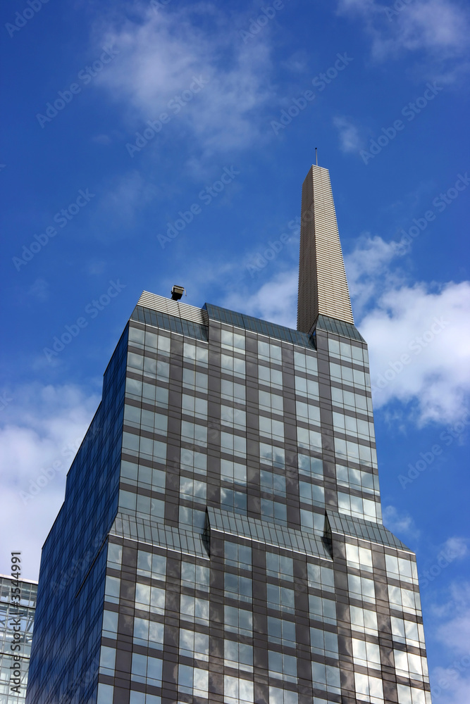 Glass highrise building in midtown Manhattan, New York. Glass highrise building in midtown Manhattan, New York.
