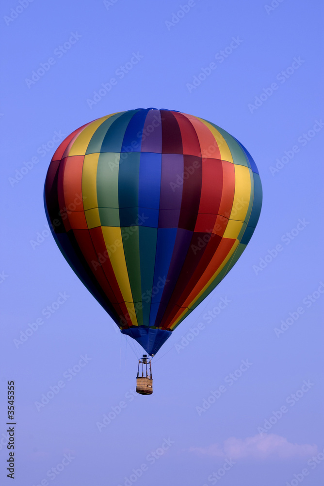 hot air balloon floating peacefully in the blue sky hot air balloon floating peacefully in the blue sky
