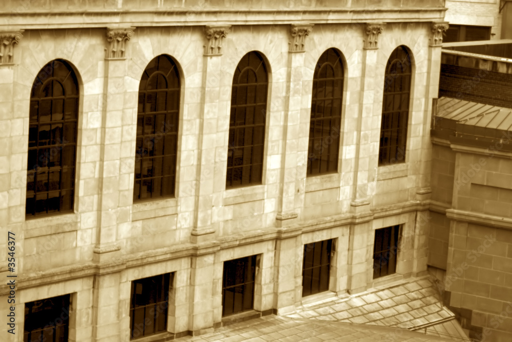 sepia image of old building in boston showing arched windows