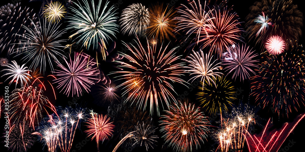 many bright coloured fireworks over black background many bright coloured fireworks over black background