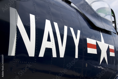 US Navy markings on the side of a restored vintage aircraft.