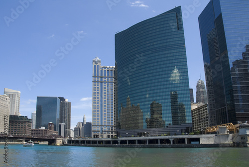 Downtown Chicago reflected in the glass towers on Wacker Drive.