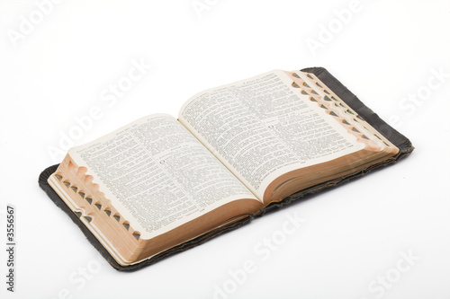 Antique Bible photographed in the studio on a white background