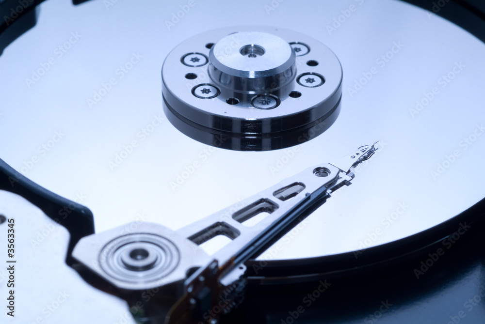 close up macro of an opened computer harddrive. close up macro of an opened computer harddrive.