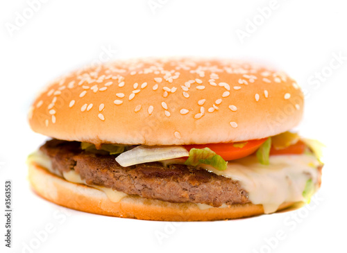 Cheese burger with lettuce and tomato,over a white background