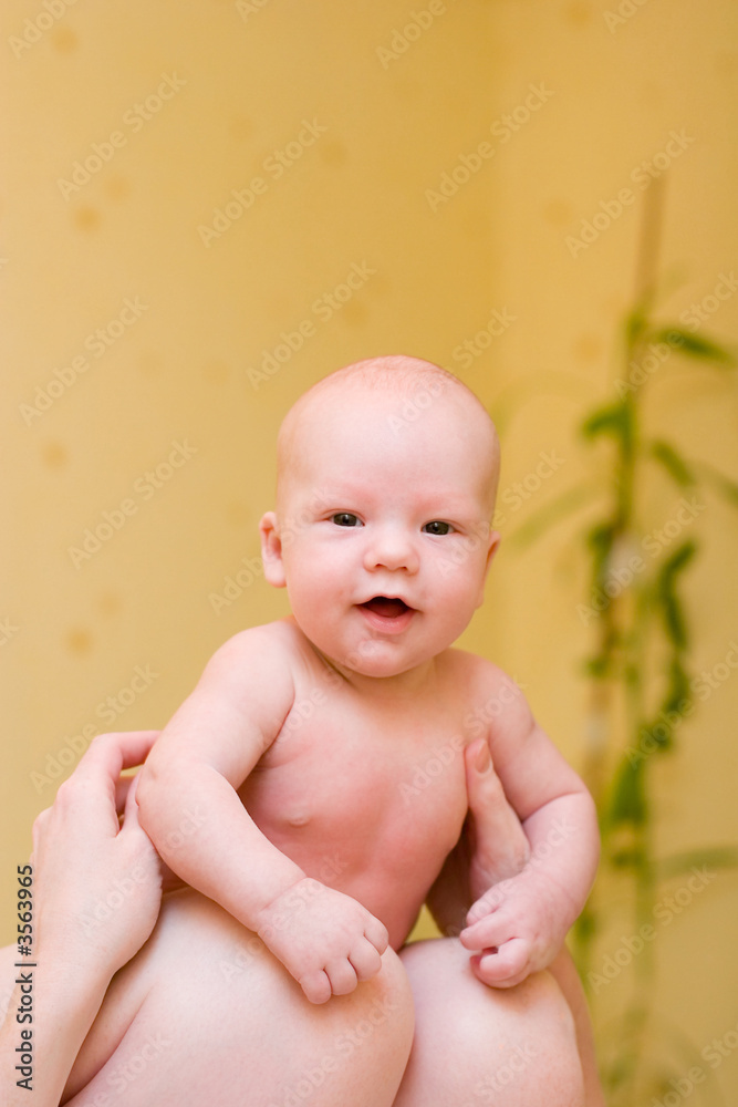 Mother holding on laps enjoying baby Mother holding on laps enjoying baby