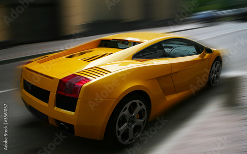Yellow respectable automobile on a dim background