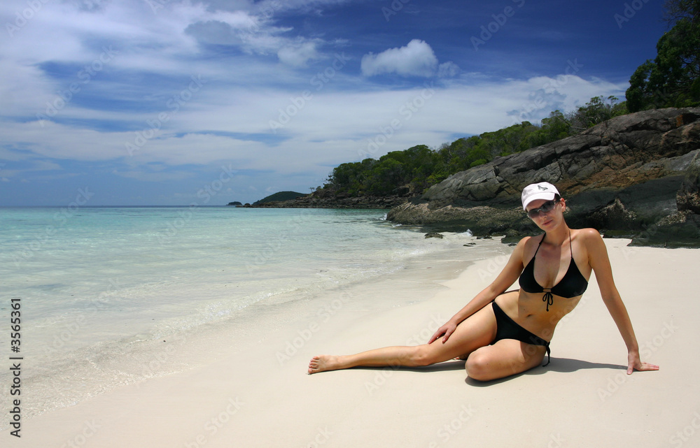 Bikini girl spending day on a tropical beach