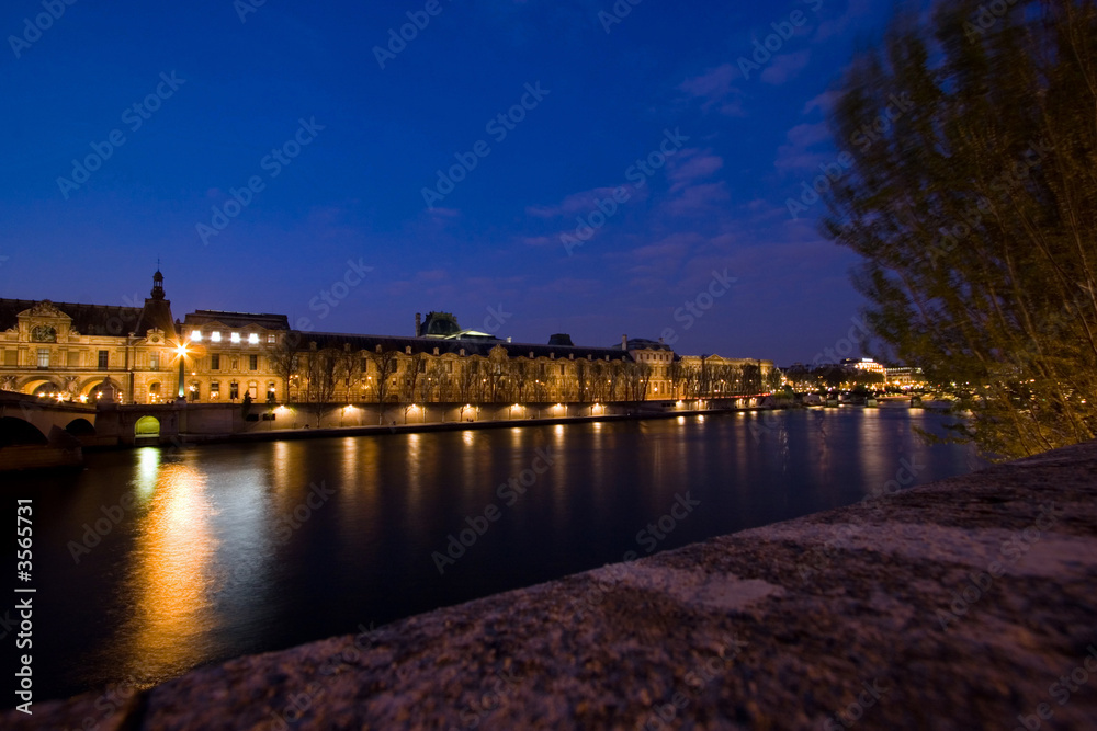View across the Seine River at night, Paris, France